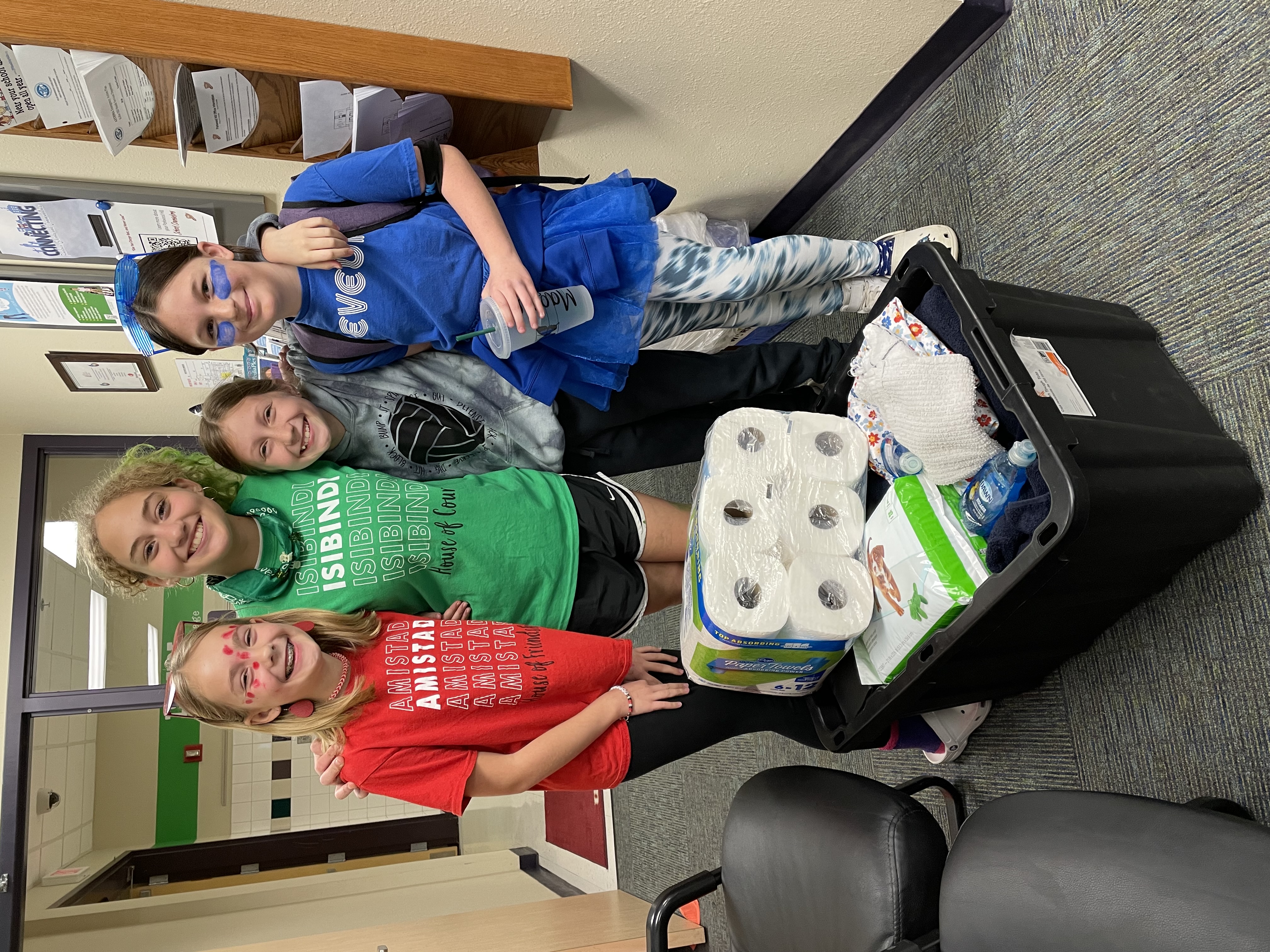 Maggie Galegher and friends pose with donations.